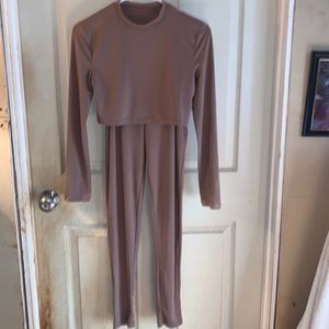 Sexy 2-piece outfit with Crop top and top side cutouts on pants. Size S